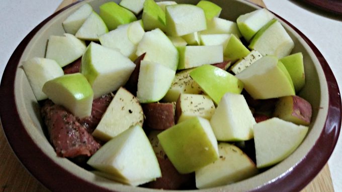 pampered chef deep covered filled with apple, potato and pork tenderloin