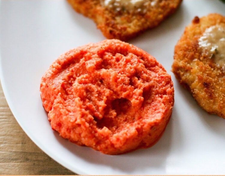 roasted red pepper cauliflower mash on a white plate