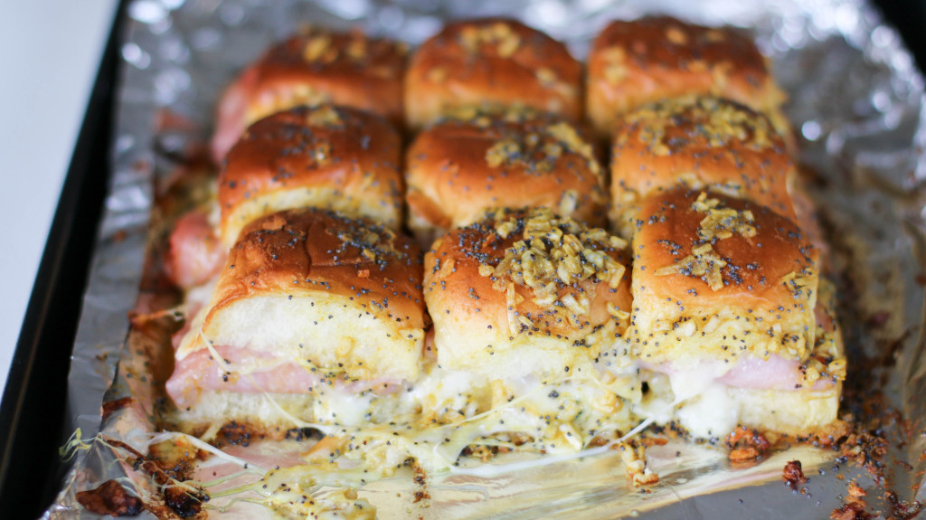 hot ham and cheese sliders on aluminum foil