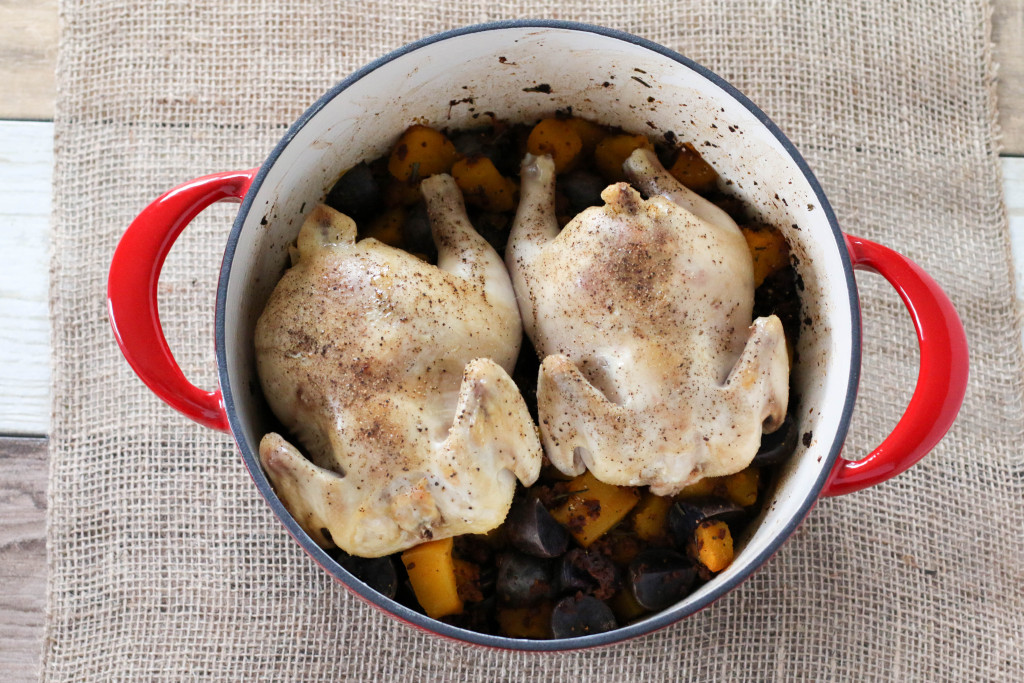 Cornish hens with pumpkin, purple potatoes and chorizo