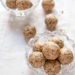cinnamon protein balls in a glass jar and on parchment paper