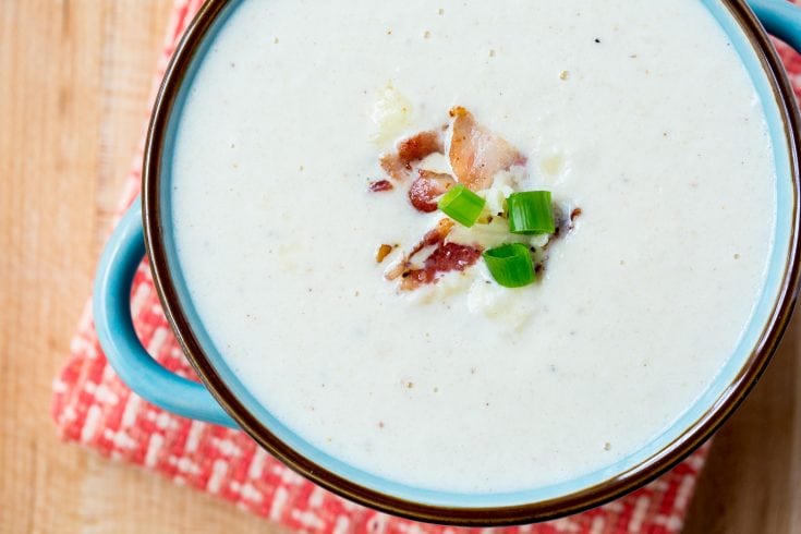 Keto Cauliflower Soup with Bacon topped with bacon and green onion