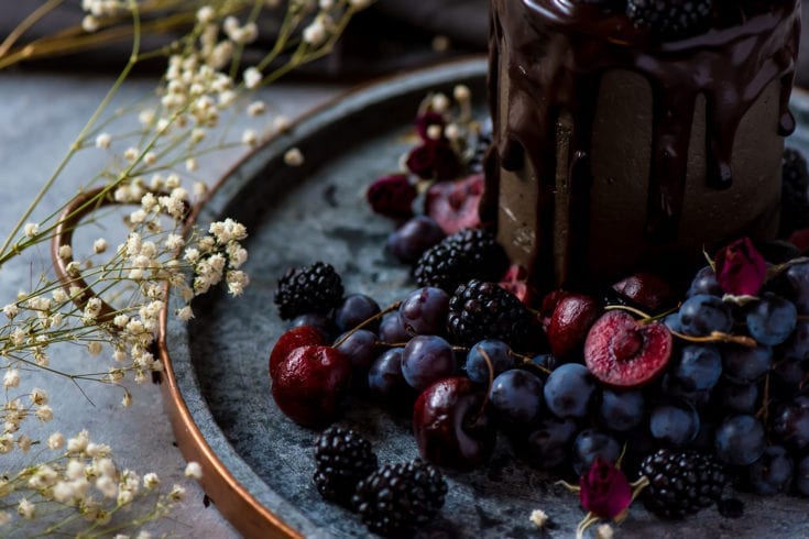 close up of a decadent cake with fruit