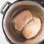 instant pot with 2 chicken breasts in it