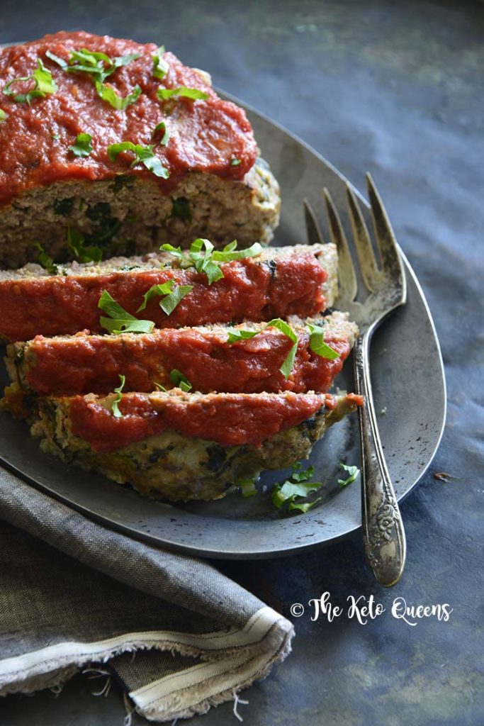 image of meatloaf florentine with a fork and topped with parsley 