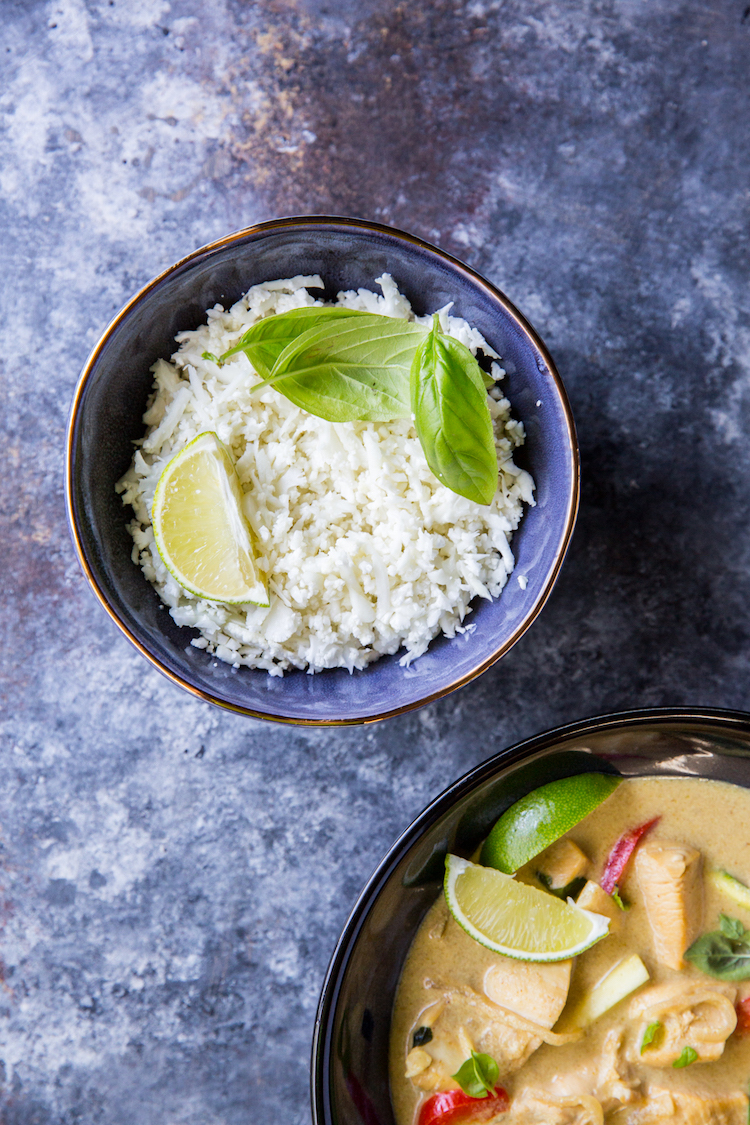 riced cauliflower in a bowl with thai green curry
