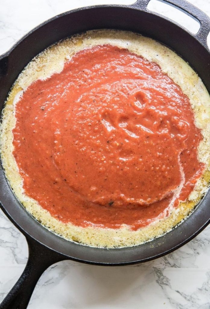 red creamy sauce in a cast iron skillet