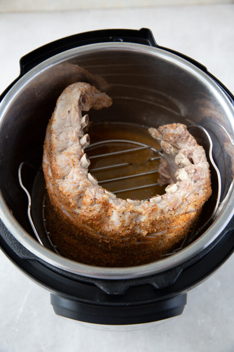 a cooked rack of baby back ribs in an instant pot