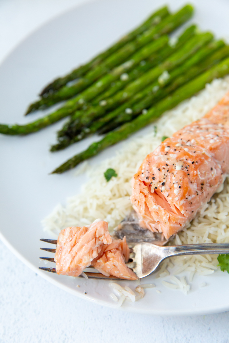 baked salmon with a fork bite taken out