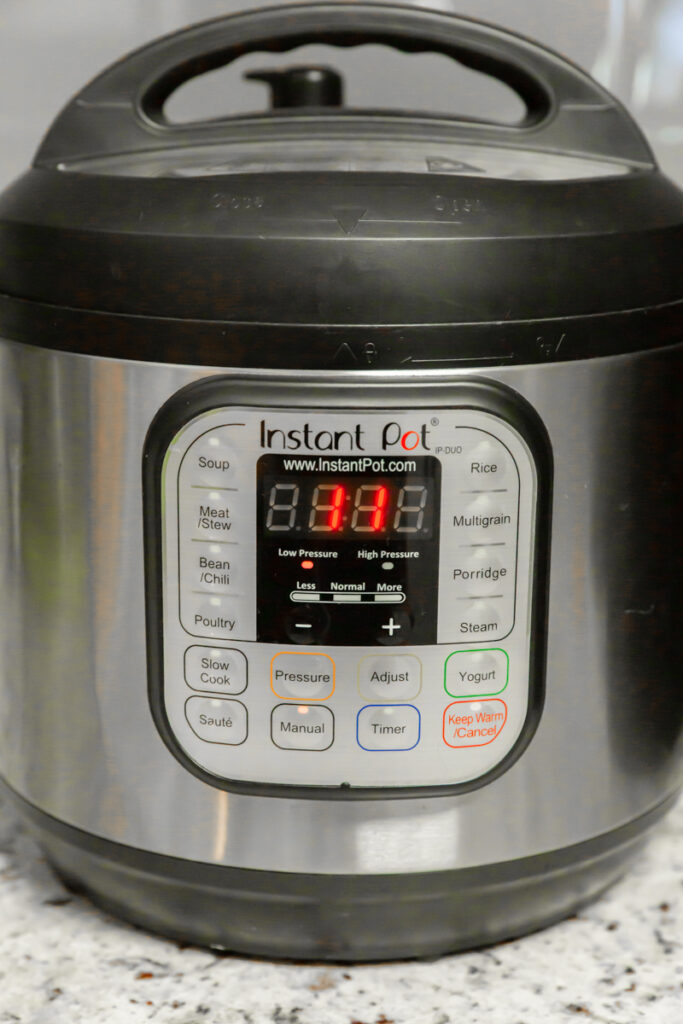 instant pot with timer set to 11 minutes
