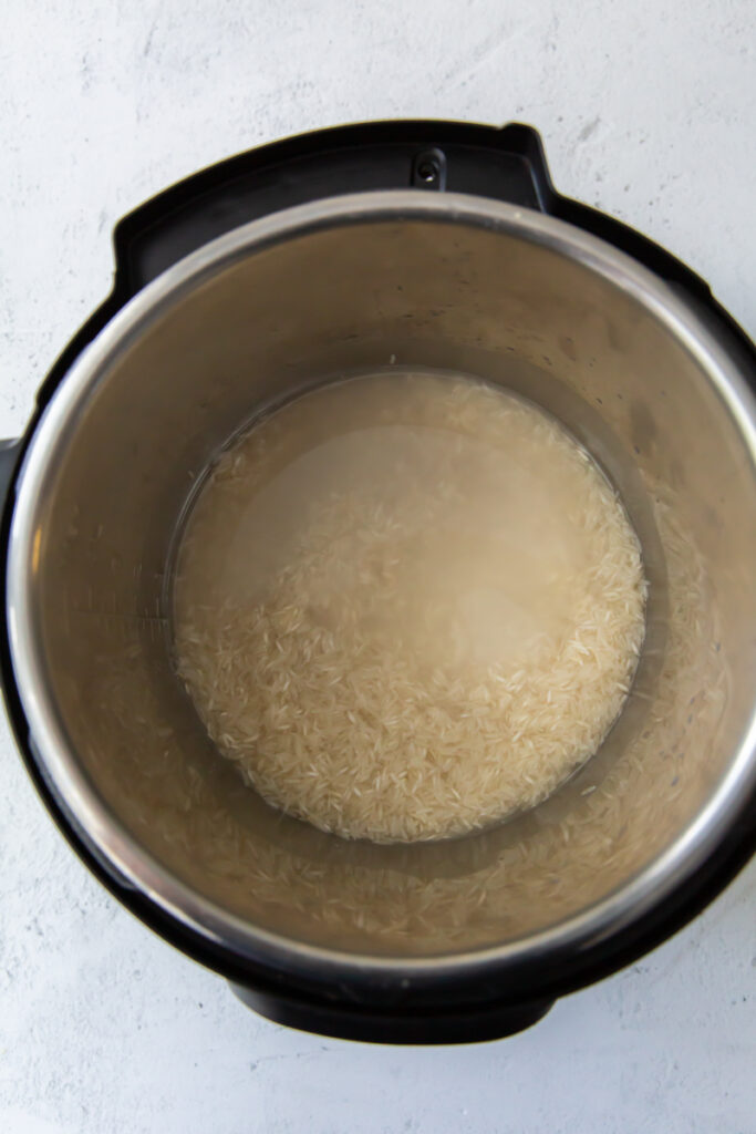 salt, water and rice in an instant pot