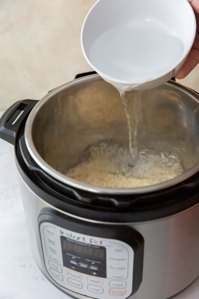 pouring water into an instant pot