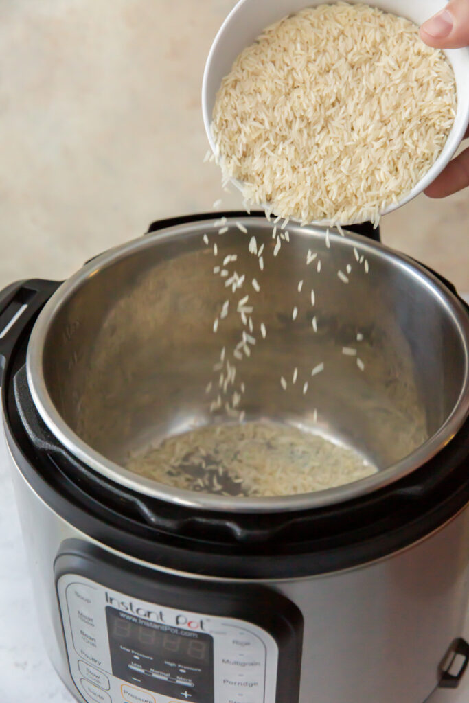pouring rice into an instant pot