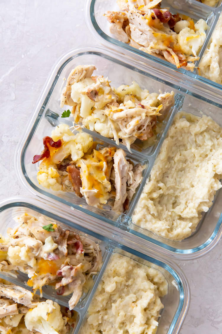 keto chicken bacon ranch and mashed cauliflower in glass meal prep containers