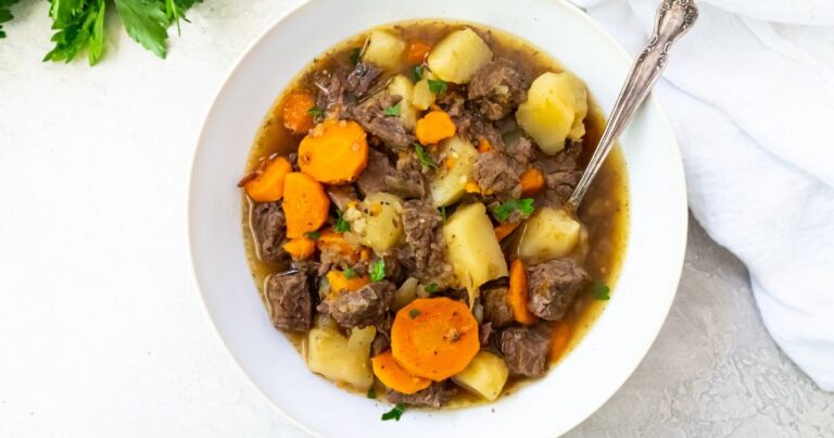 The Best Instant Pot Rump Roast Recipe on a white plate with potatoes, carrots and parsley.