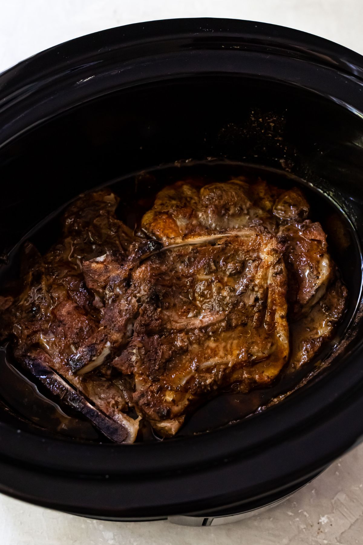 cooked pork chops in a slow cooker