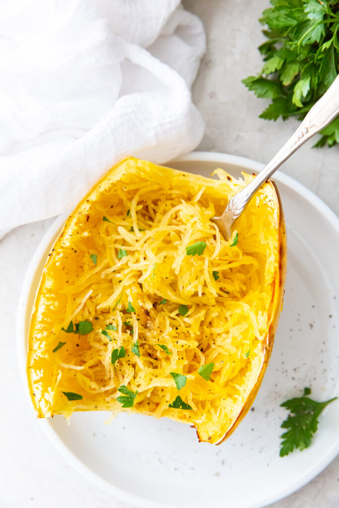 air fryer cooked spaghetti squash with a fork and white napkin