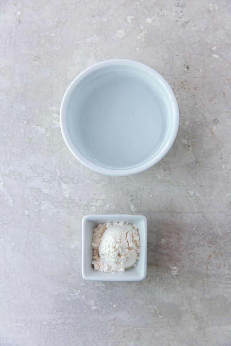 water and tapioca flour in small containers on a light surface