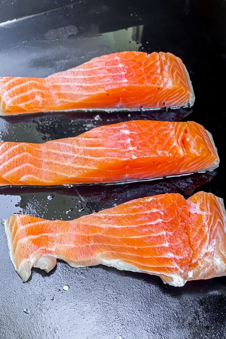 salmon being cooked on the Blackstone skin side down