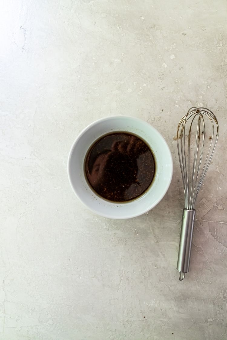 pork marinade in a bowl and a whisk