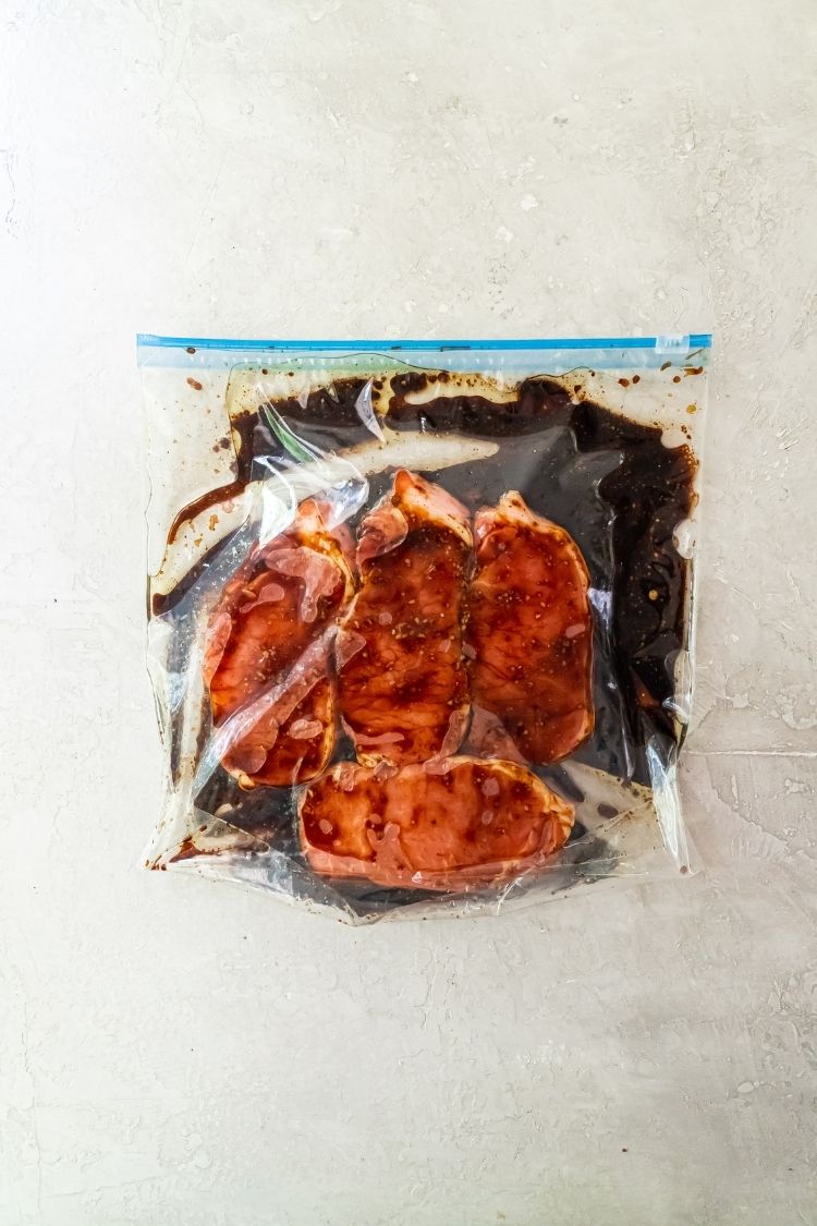 pork chops marinating in a bag