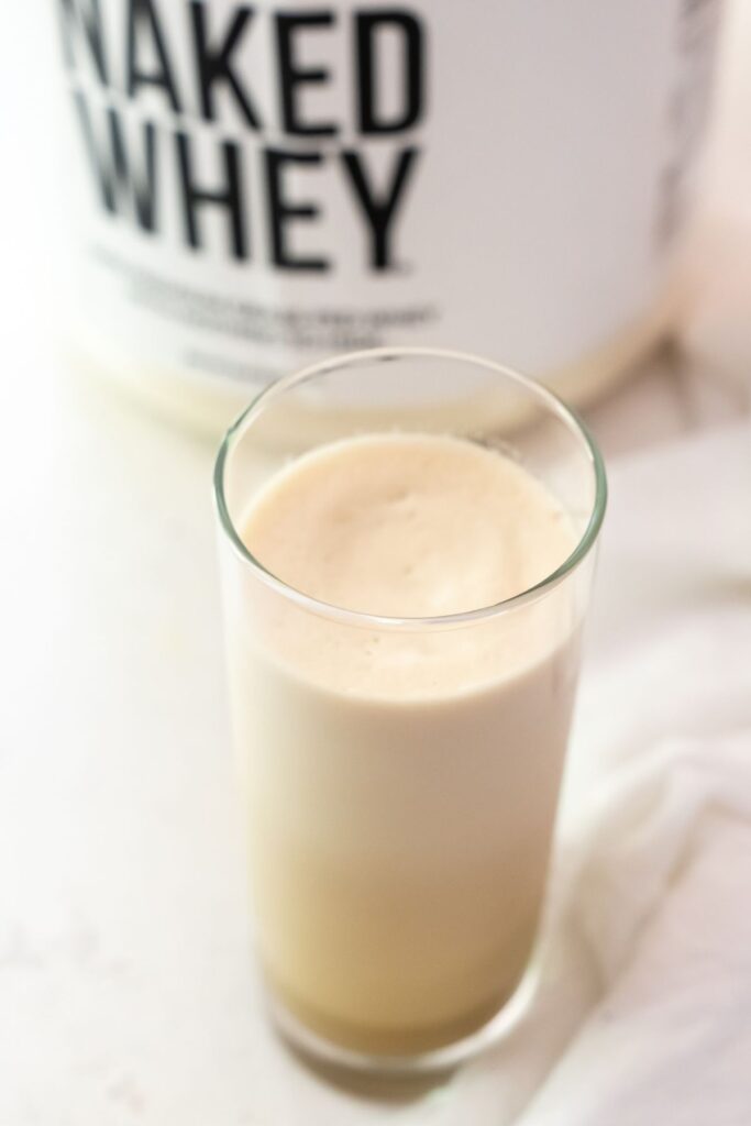coffee protein shake in a clear tall glass