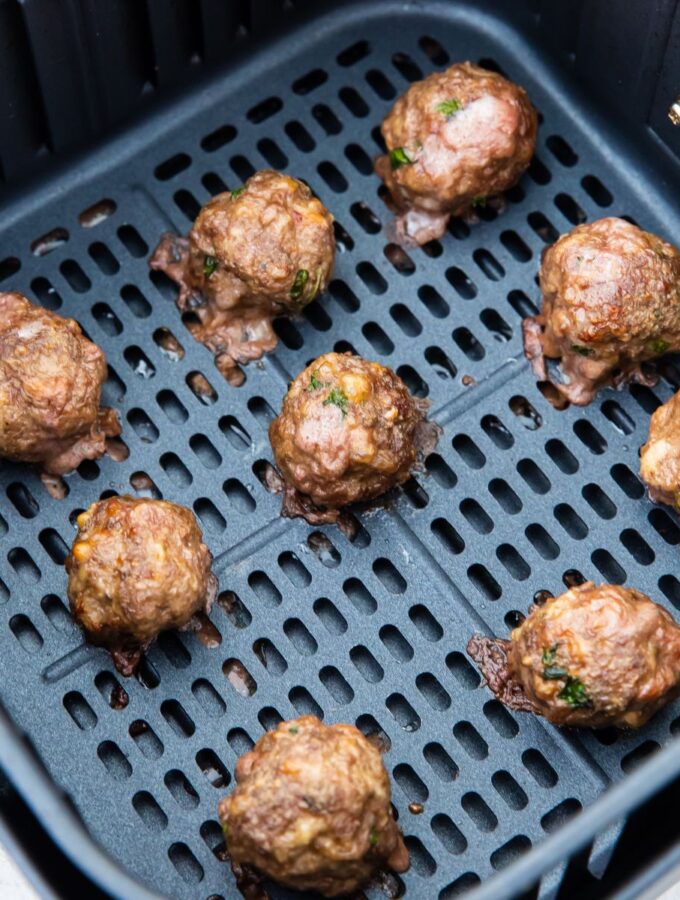 keto meat balls cooked in an air fryer basket
