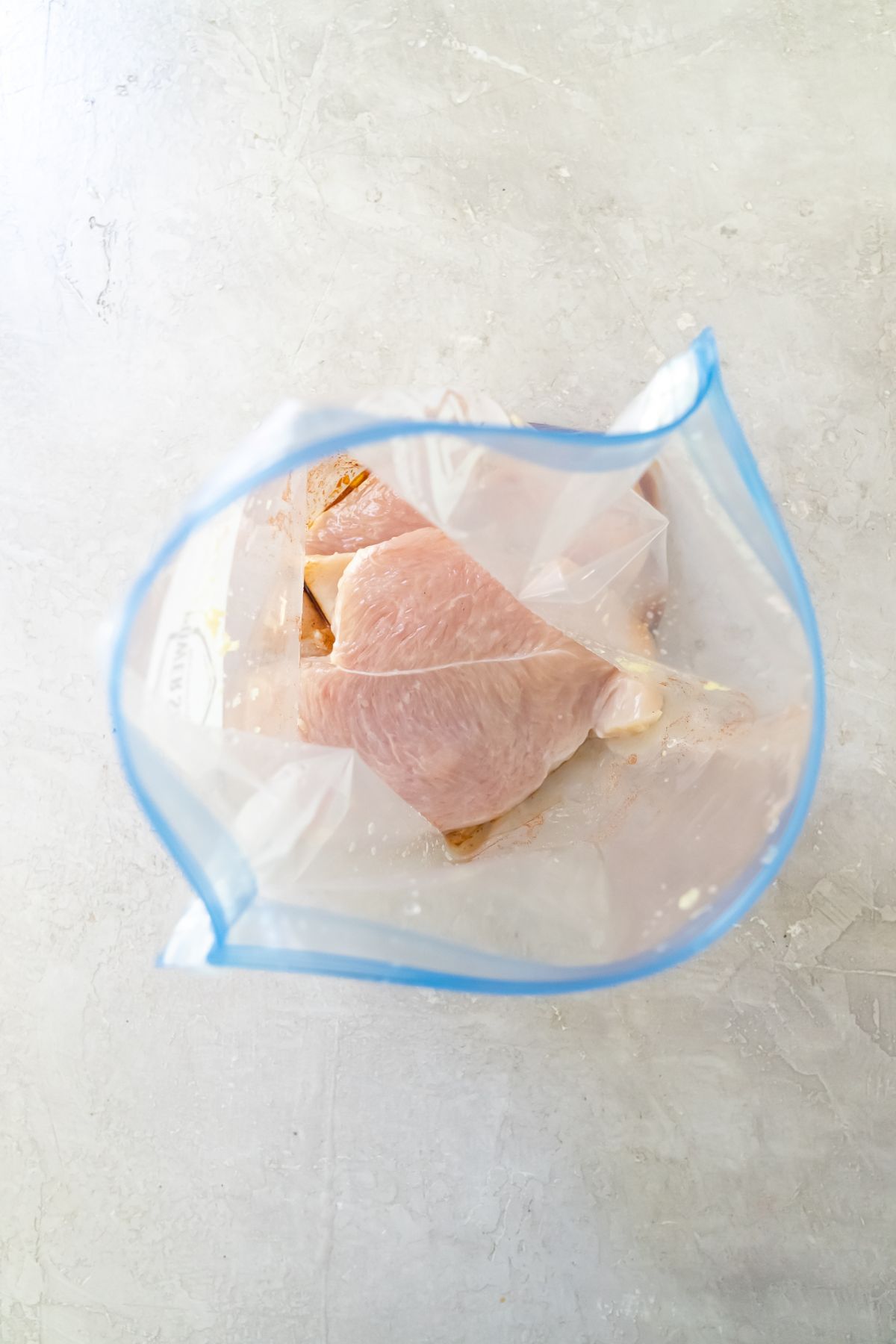 raw chicken in a ziploc bag