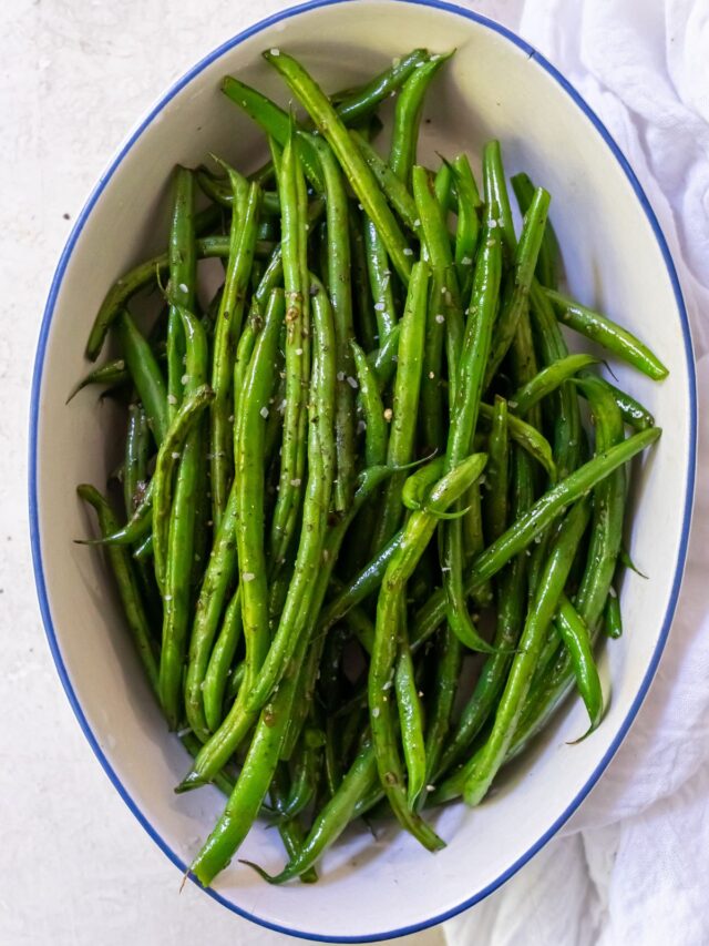 green beans in a large bowl with a large spoon