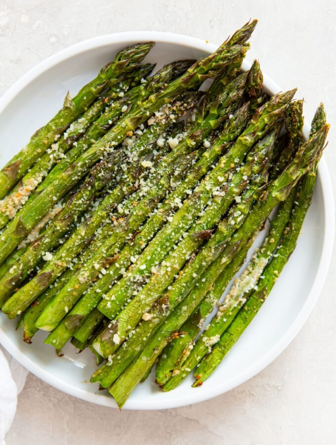 cooked asparagus on a white plate