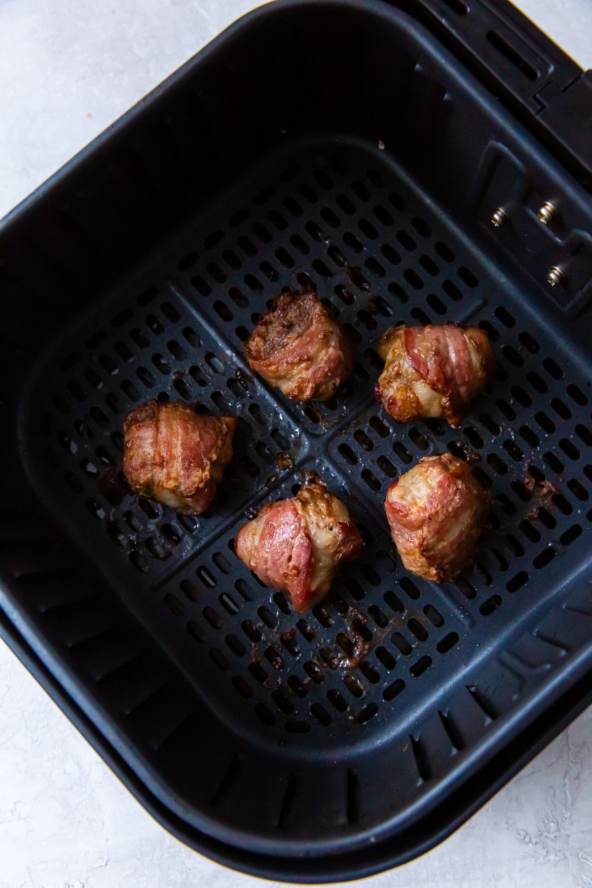 cooked bacon wrapped meatballs in the air fryer