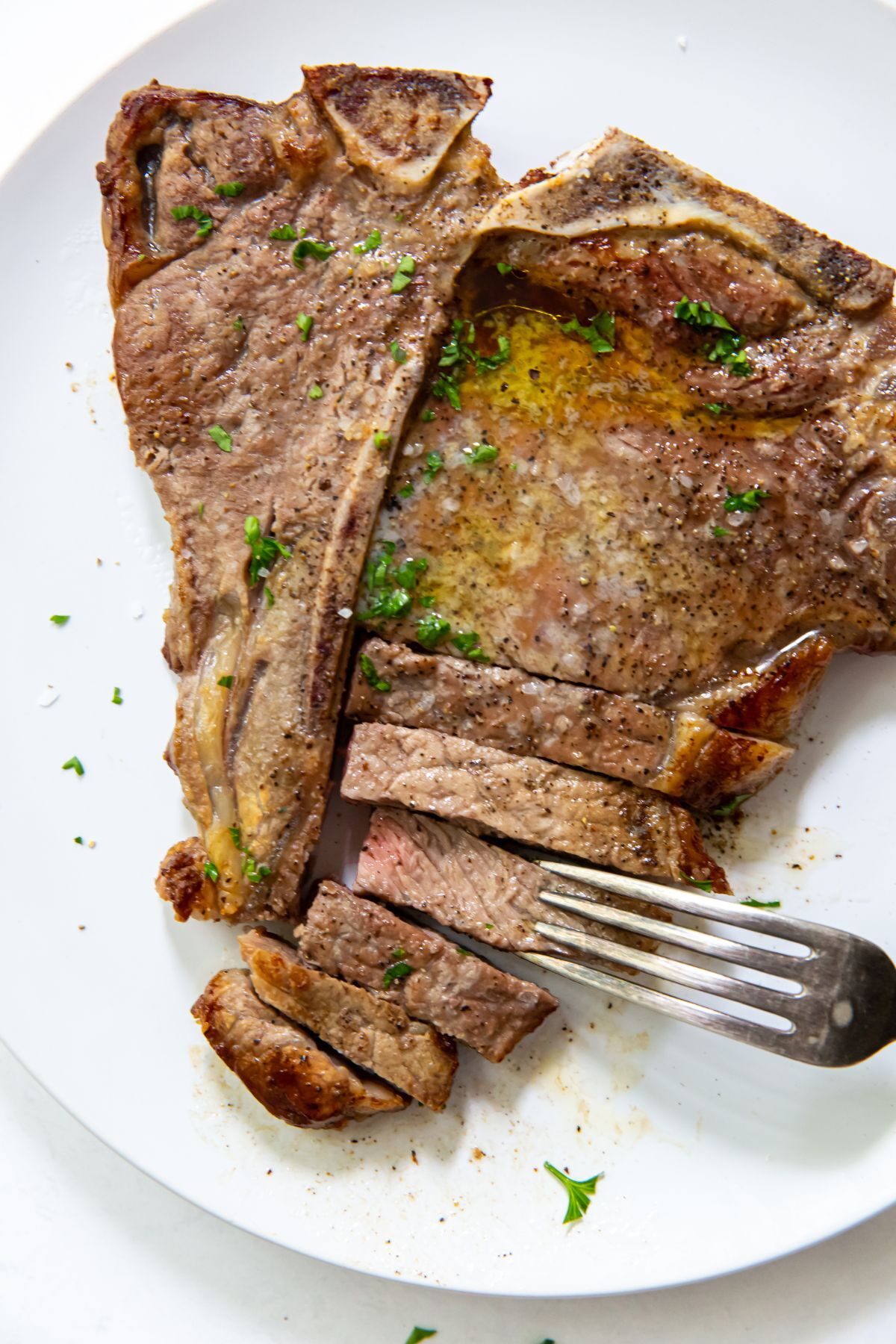 Season the T-bone steak with salt and pepper