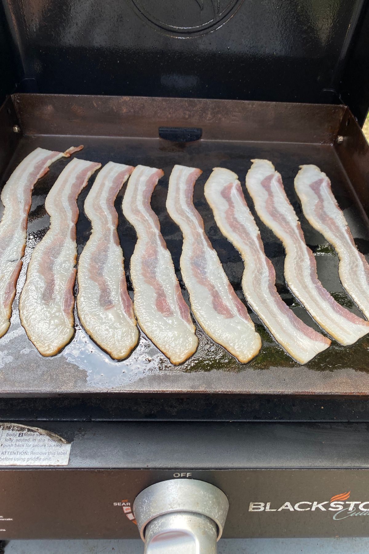 raw bacon on the blackstone