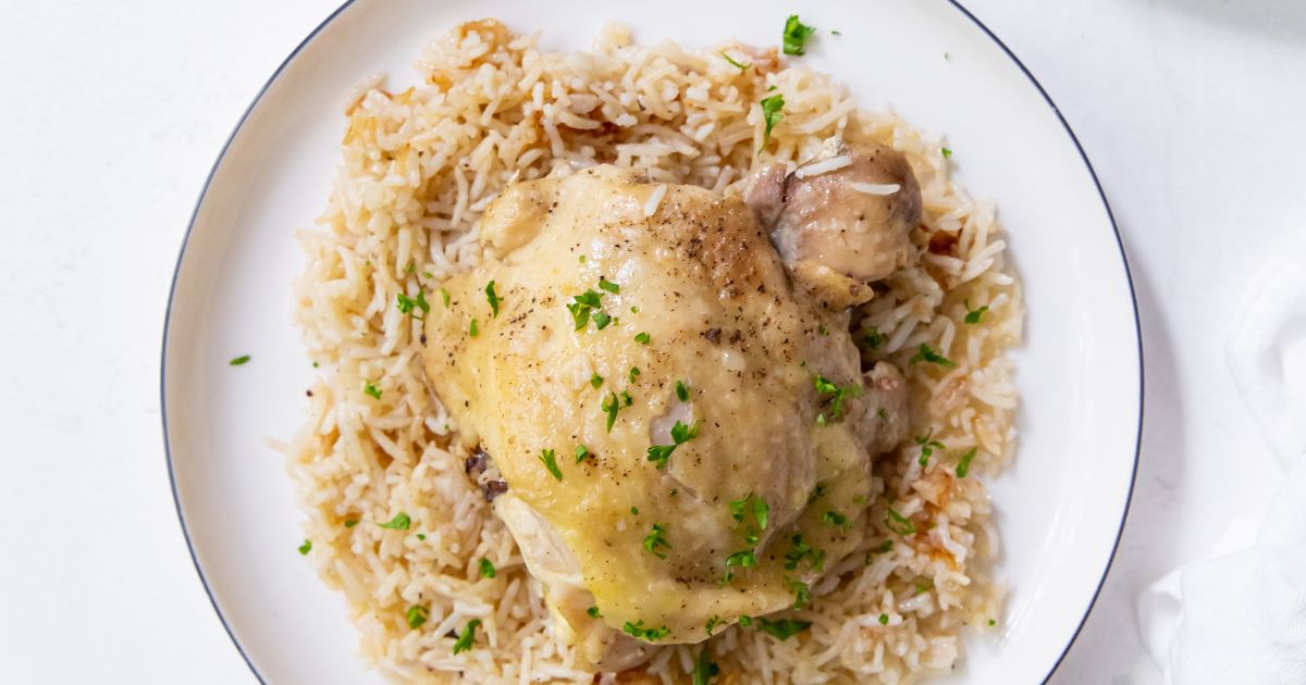 instant pot chicken thighs and rice on a white plate