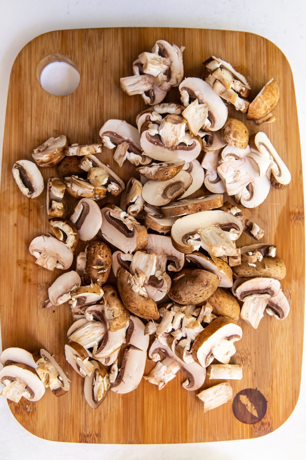 mushrooms cut up on a cutting board