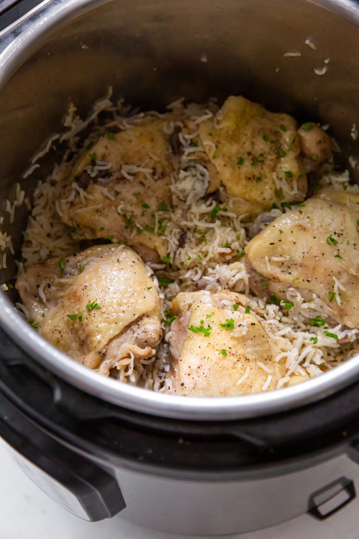 cooked chicken thighs with rice in the instant pot