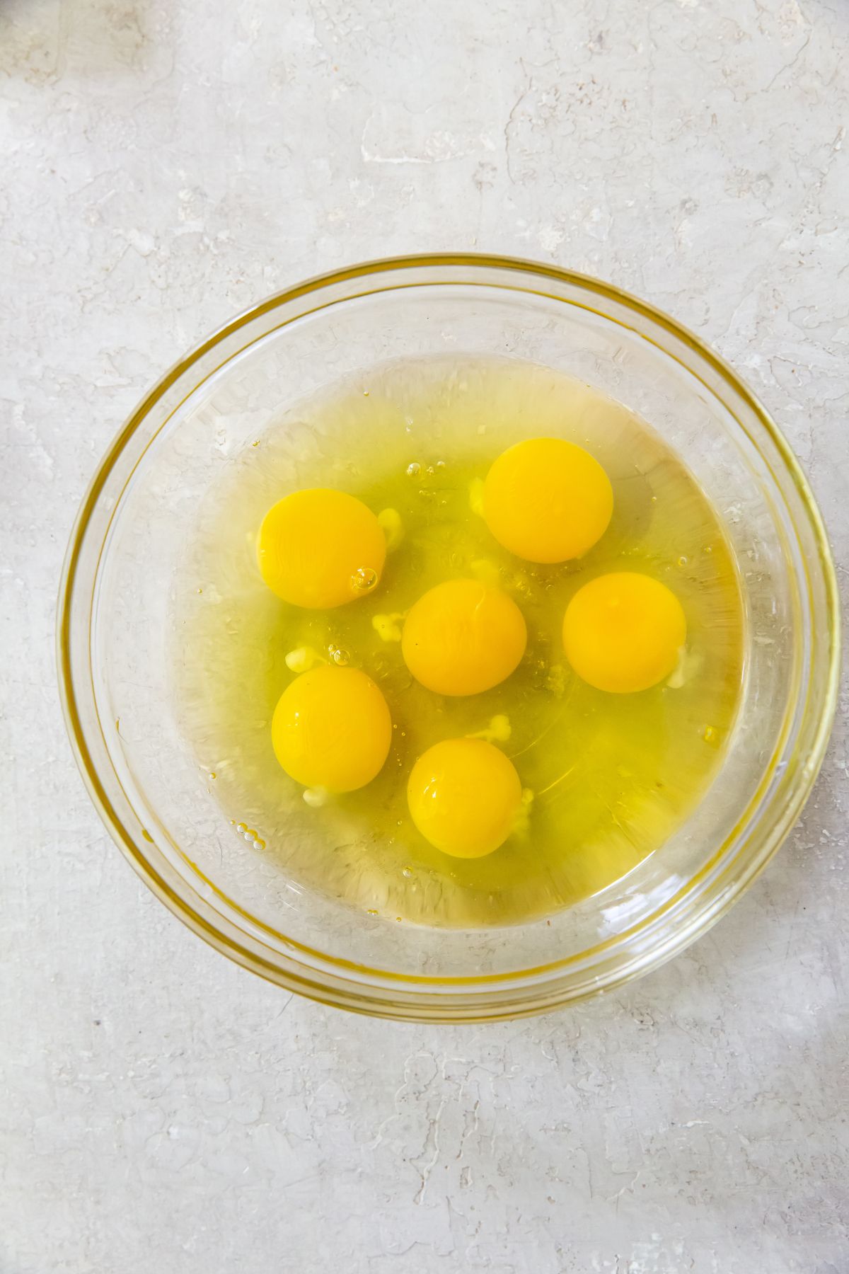 raw eggs in a clear bowl