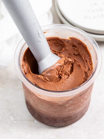 keto chocolate protein ice cream in a pint with an ice cream scoop