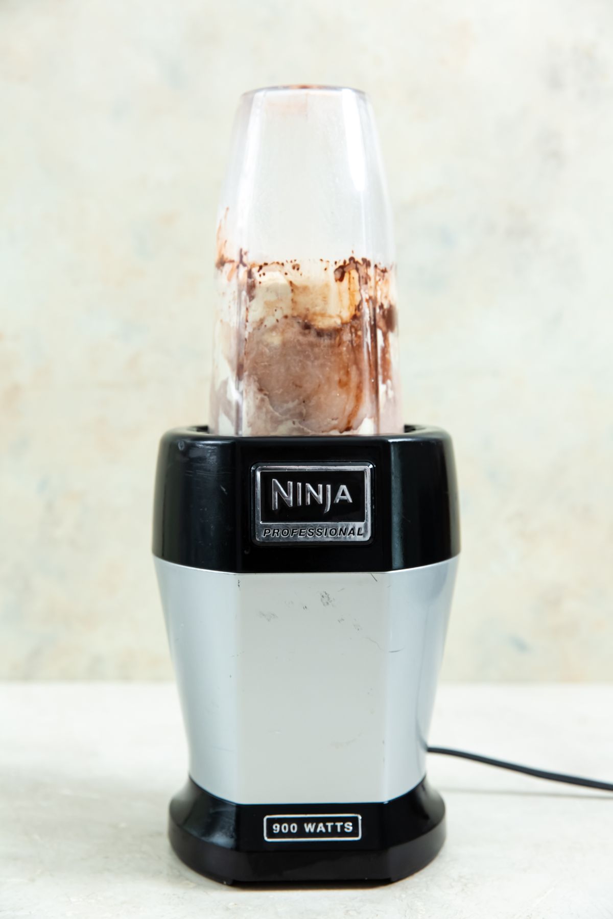 a ninja blender with protein ice cream ingredients