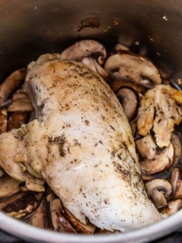 cooked chicken breast and mushrooms inside an instant pot