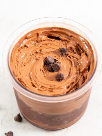 Ninja creami chocolate protein ice cream in a pint topped with chocolate chips