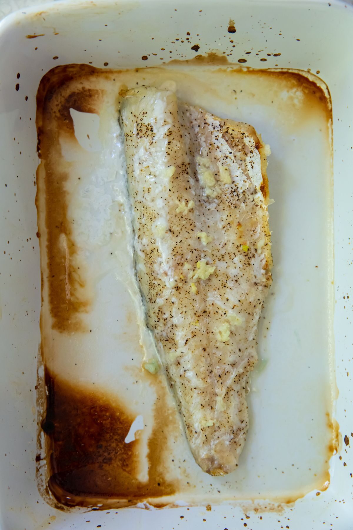 cooked walleye in a baking dish