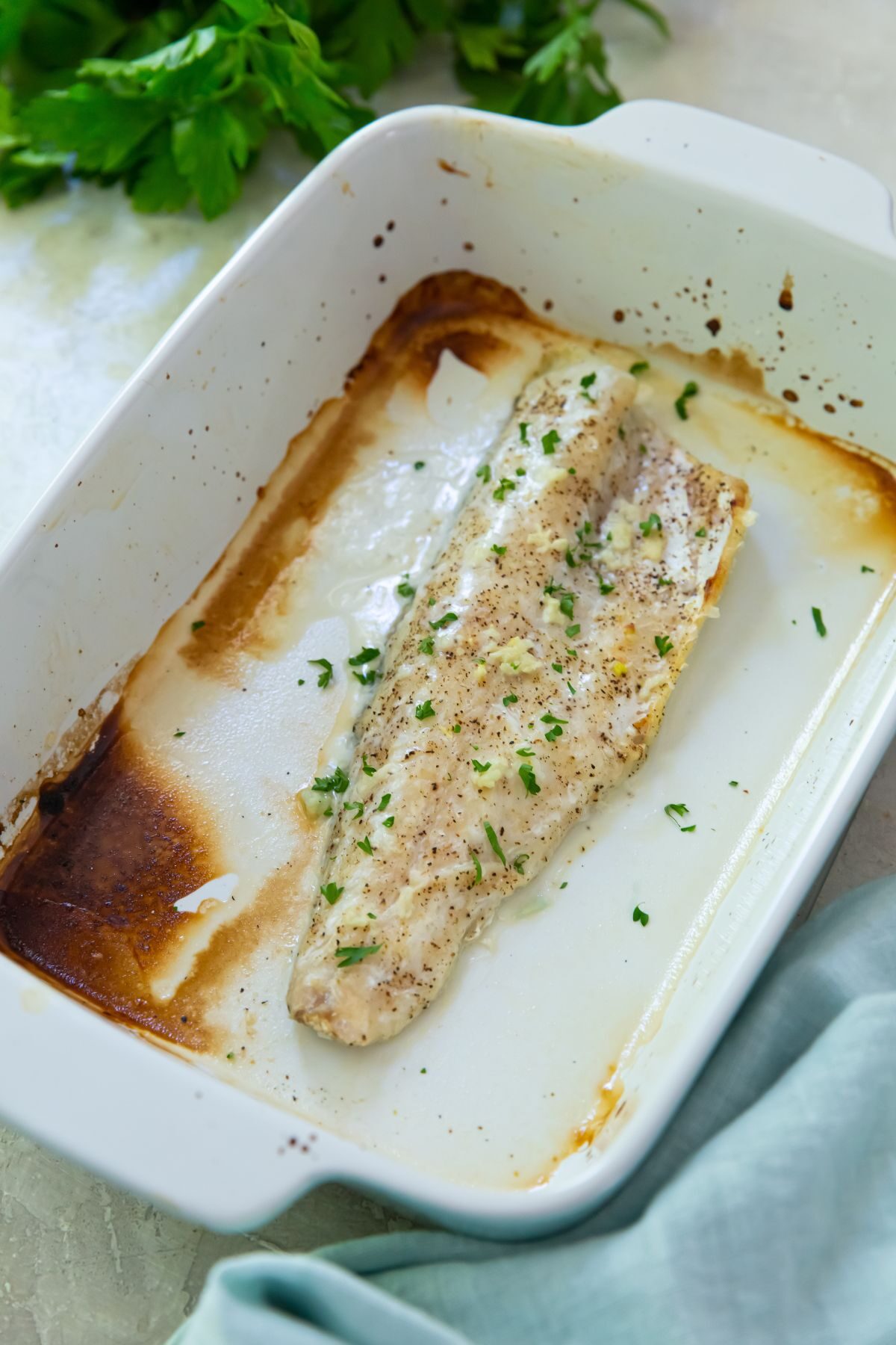 cooked walleye in a baking dish