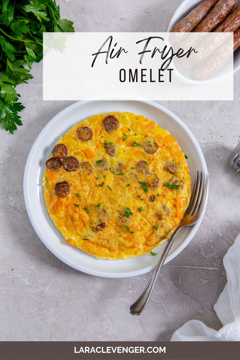 pin of Air Fryer Omelette on a white plate with a fork on the side