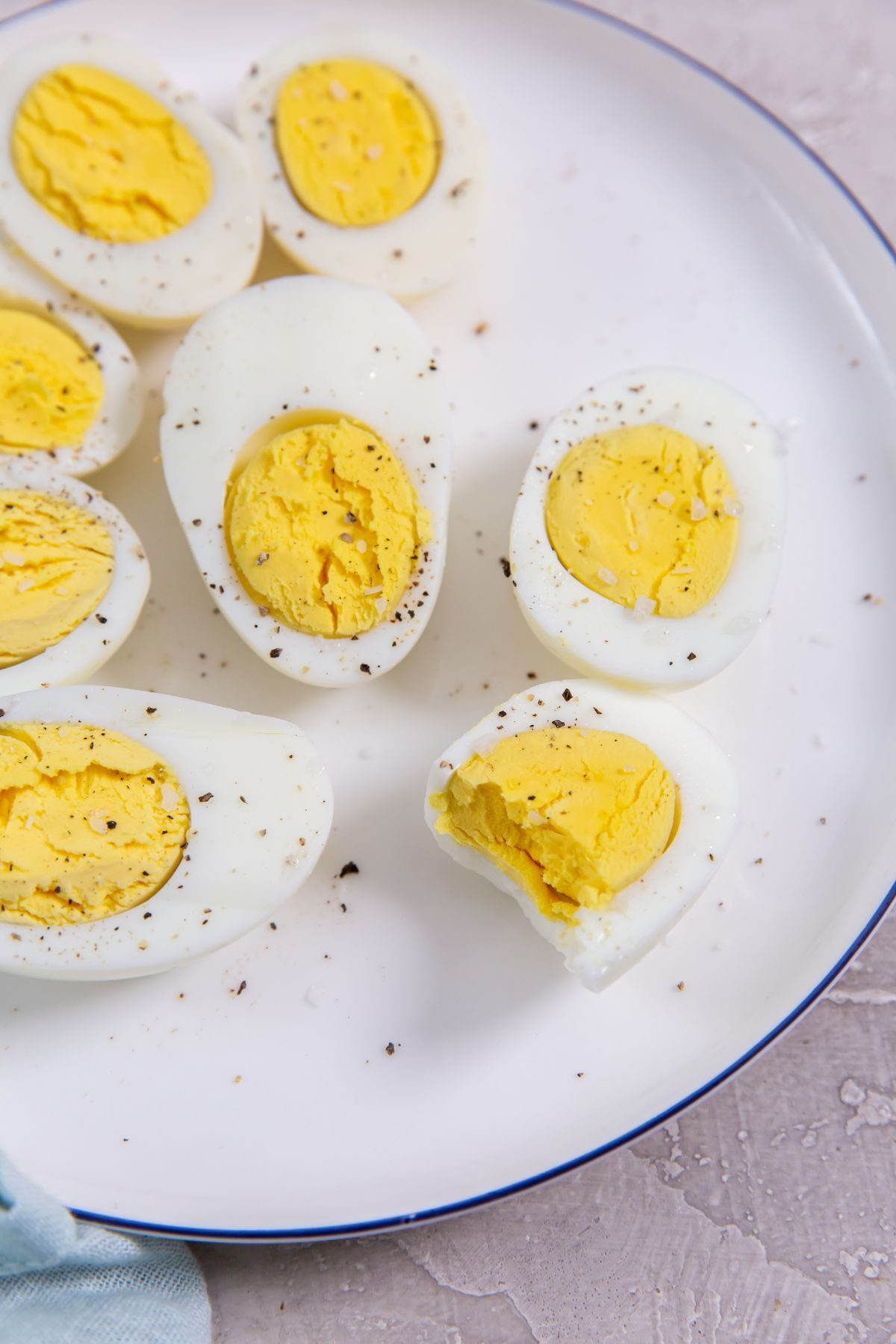 Instant Pot Eggs 5-5-5 Method cut in half on a white plate