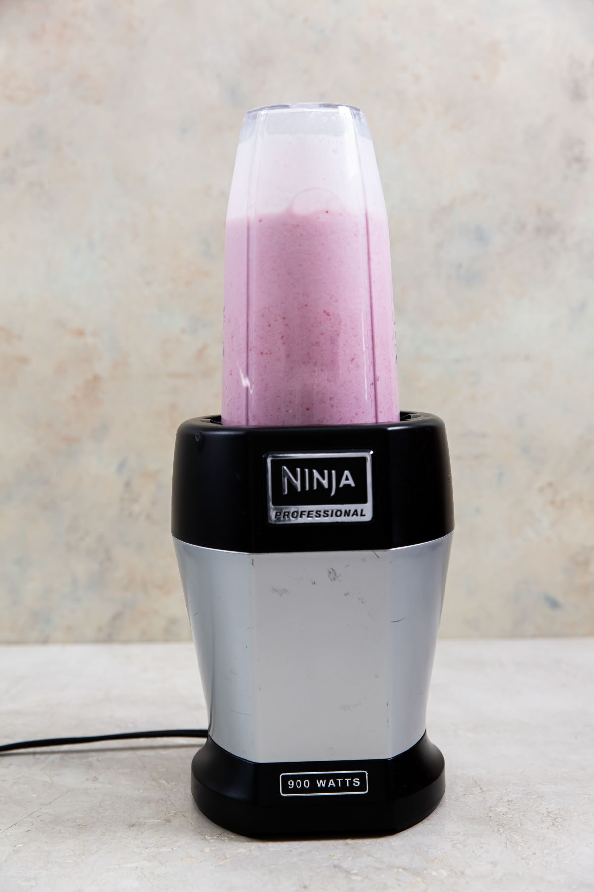 ingredients for keto strawberry ice cream in a ninja blender