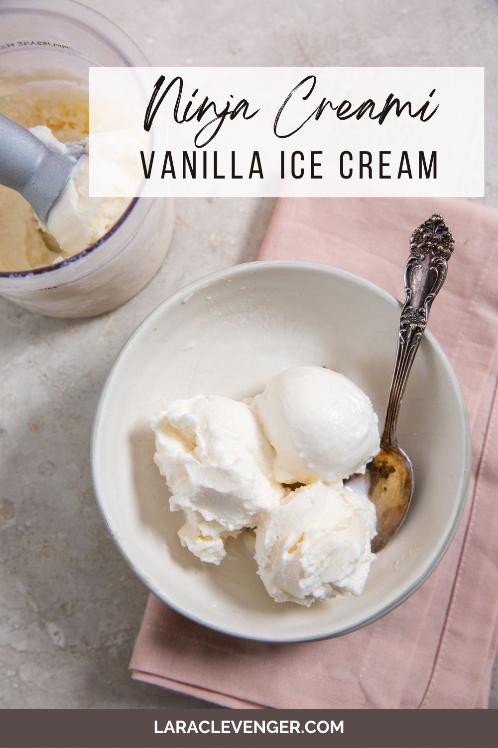 pin of Ninja Creami Vanilla Ice Cream in a white bowl with a spoon and pink napkin