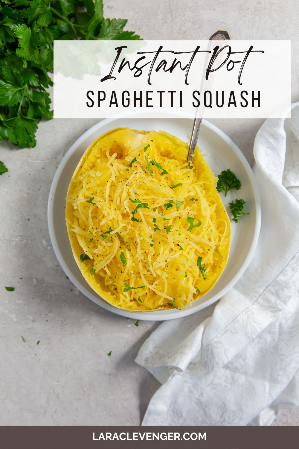 pin of Instant Pot Spaghetti Squash on a white plate with a fork in it