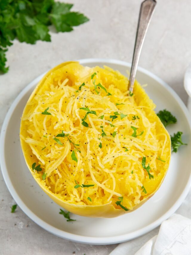 Instant Pot Spaghetti Squash on a white plate with a fork in it