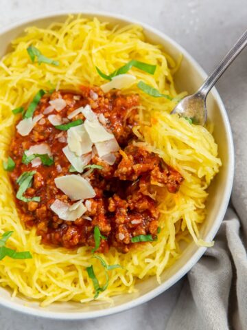 Spaghetti Squash Boats with a fork and a grey napkin on the side